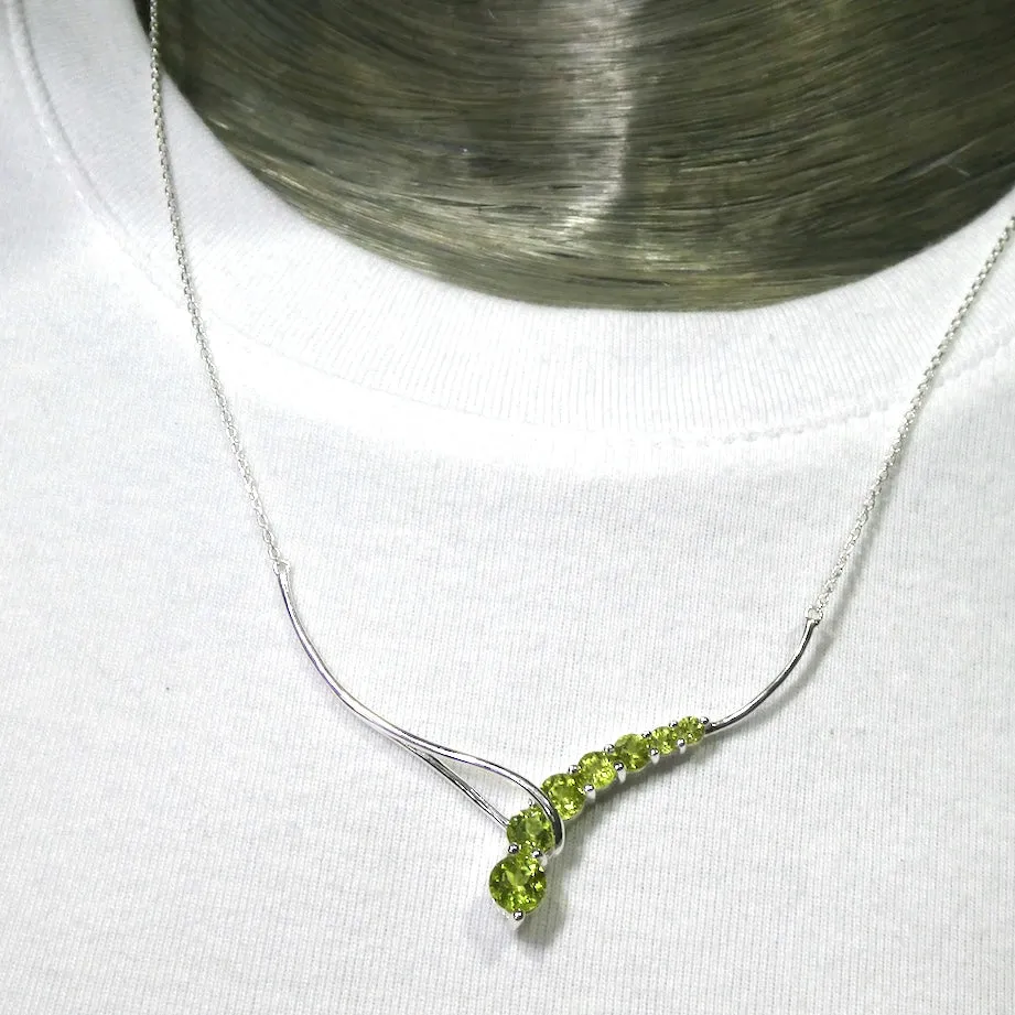 Peridot Necklace, 7 faceted Rounds, Comet, 925 Sterling Silver