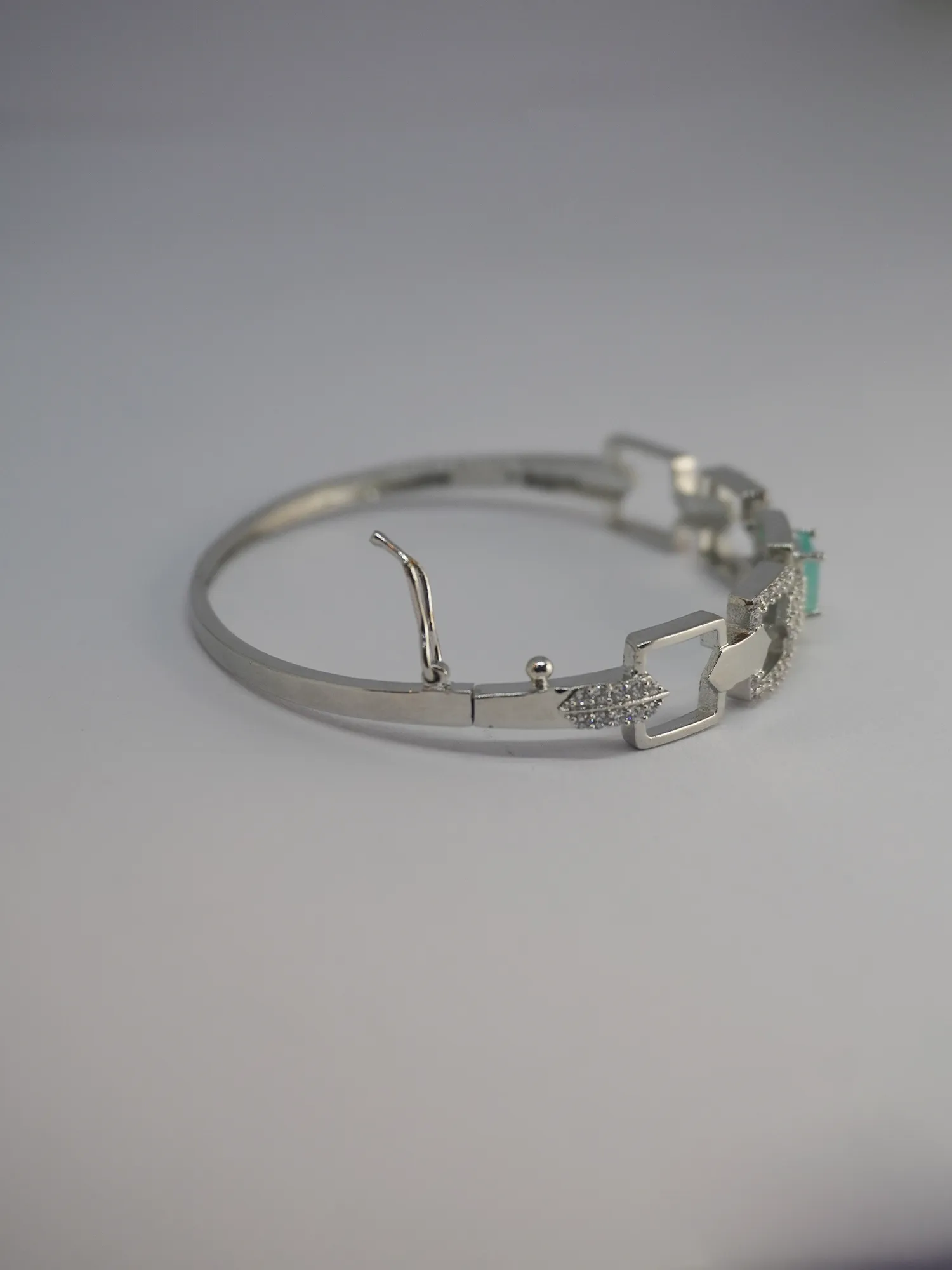 Rhodium-Plated Green Stone Bracelet with American Diamond